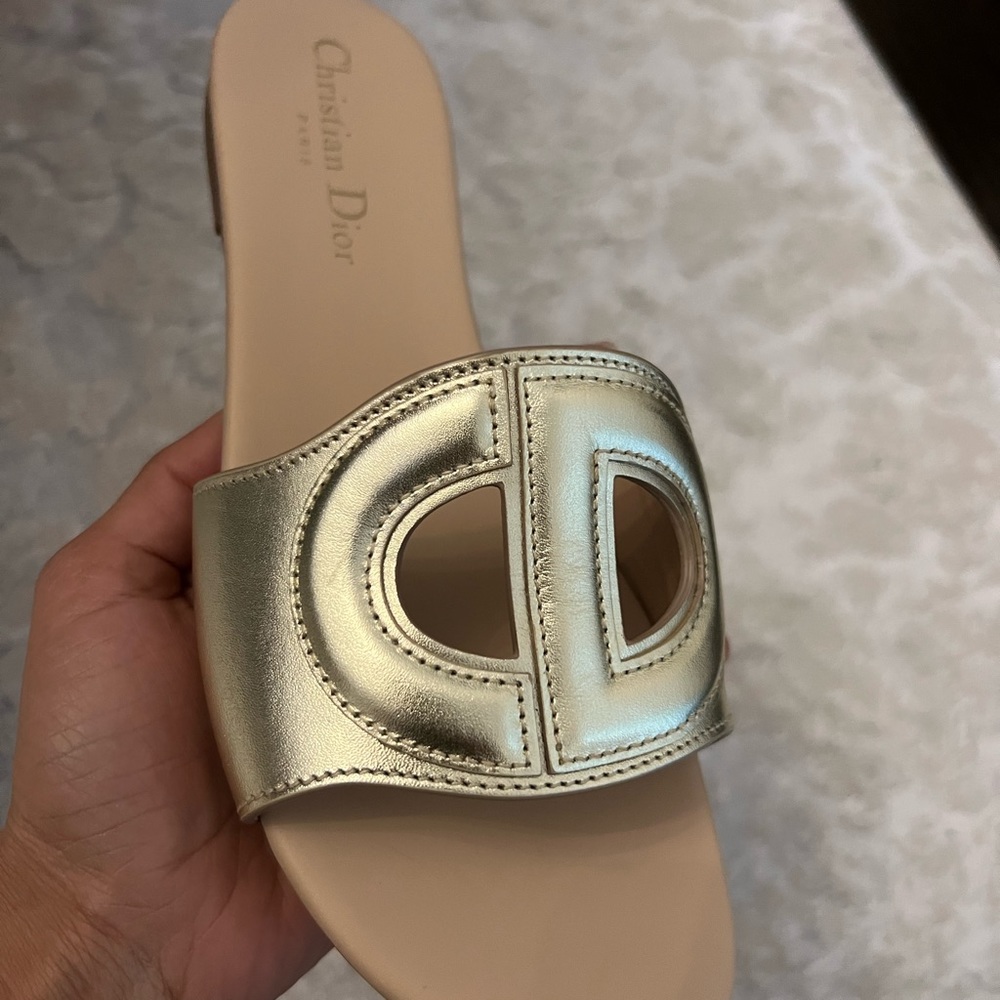 Brand new Christian Dior S club slide in Gold